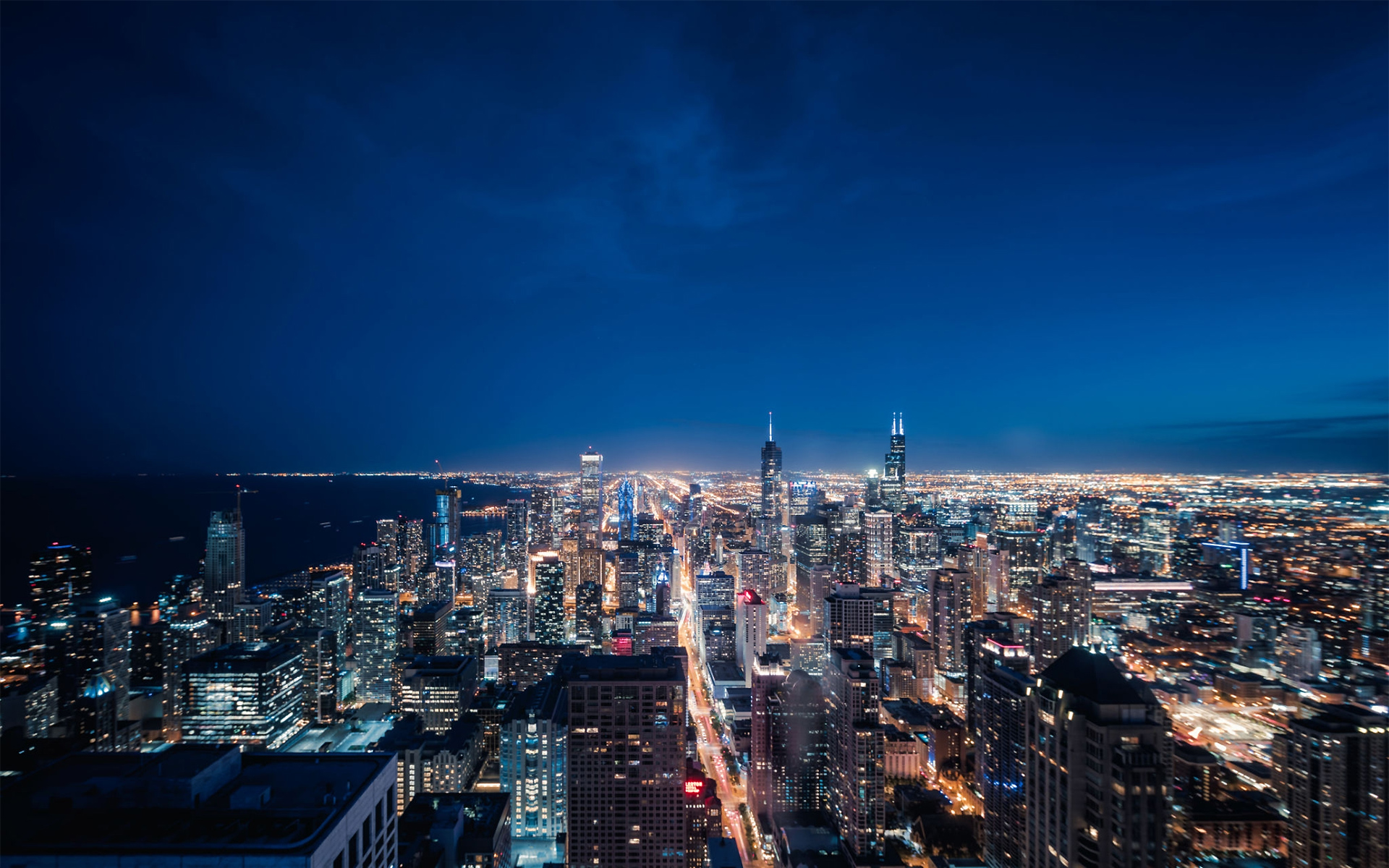 https://comercios506.com/wp-content/uploads/2021/01/1160442138-Aerial-View-of-Chicago-cityscape-skyline-at-Night.jpg